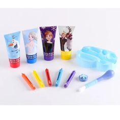 several toothbrushes, tube holders and other items on a white surface with snowflakes in the background