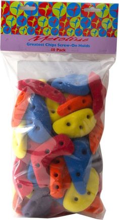 colorful plastic buttons in a bag on a white background