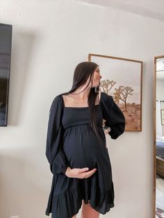 A solid hued maternity dress featuring long sleeves, a smocked back, a ruffle hem and a square neckline. Goth Maternity, Maternity Outfits, Baby Shower Outfit, Maternity Dress, Square Necklines, Maternity Dresses, Maternity Clothes, Square Neckline, Ruffle Hem