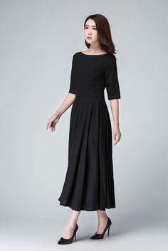 "Create a classic and chic ensemble with this Black maxi dress featuring a fit and flare silhouette . Completed with boat neck linen , three quarter sleeve, it is finished with a hidden Back zipper . This little black dress is perfect for transitioning from the office to an evening in the city . DETAILS * Linen blend * 50% linen , 50% cotton blend * Fitted waist to show off your curves * Boat neckline * Back zipper closure * No pockets * 3/4 sleeve * Midi calf * Wash by hand or machine via cold Chic Black Boat Neck Midi Dress, Chic Black Midi Dress With Boat Neck, Elegant Black Fit And Flare Maxi Dress, Black Fit And Flare Maxi Dress, Chic Black Boat Neck Dress, Fitted Linen Midi Dress For Evening, Formal Summer Midi Dress With Boat Neck, Summer Formal Midi Dress With Boat Neck, Black Fitted Boat Neck Midi Dress