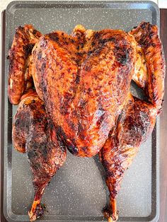 a roasted turkey on a pan with text overlay that reads tender fancy splathock turkey