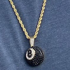 Men's iced black 8 ball hip hop chain. 14k yellow gold plated over alloy metal. 1 inch Eight Ball iced with dazzling stones. Chain measures 24" inches x 4 mm thick. Stylish & secure lobster claw clasp lock. Has a caged back for strong support. Solid weight to it at a 40 grams total. Shines so hard the stones will blind you. 100% FREE SHIPPING in USA. Order now! Eight Ball, Hip Hop Chains, Gold Rope Chains, Rope Chain Necklace, 8 Ball, Hip Hop Jewelry, Pendant Gold, Rope Chain, Lobster Claw