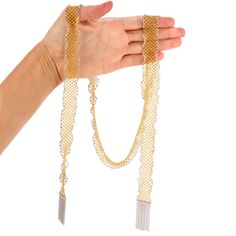 This extra long Italian Made Mesh Scarf necklace is crafted in solid 18k yellow gold with 18k white gold borders. This wrap around bead necklace is 41 inches long and 20 mm wide with 18k white gold tassel at the end. Weight : 107.2 Grams In stock in excellent condition. Gold Beaded Chain Jewelry For Evening, Gold Jewelry With Beaded Chain For Evening, Elegant Yellow Chain Necklace For Formal Events, Elegant Gold Long Necklace With Beaded Chain, Elegant Gold Long Necklace With Gold Beads, Elegant Silver Lariat Necklace With Gold Chain, Elegant Silver Chain Necklace With Gold Beads, Luxury Gold Long Chain Necklace, Elegant Yellow Necklace With Gold Chain