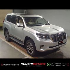 a silver suv parked in a parking garage