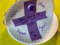 a paper plate with a purple cross on it