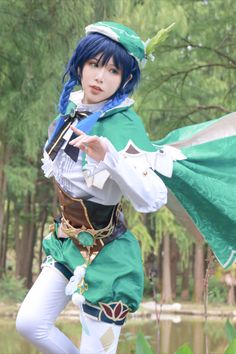 a woman with blue hair is dressed in green and white clothing while holding a flag