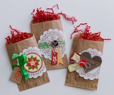 three brown paper bags with tags on them