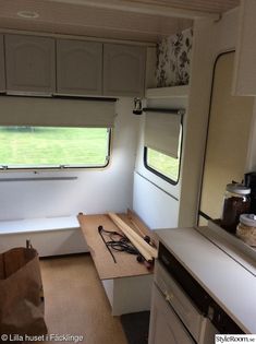 the inside of a camper that is being used as a kitchen