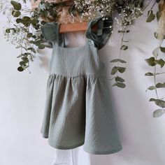 Sage green baby dress, cotton muslin with boho style ruffle diaper cover, a perfect outfit for spring. It is the cutest, the perfect gift for toddlers and newborns. Ideal garments for fun moms or to make a very special gift. You will find many assorted items in the store, it's up to you to compose your own sets! https://www.etsy.com/listing/1560447171/muslin-baby-dress-with-long-sleeves-in?click_key=39c1d339605cb5aedbac38b610c6fdbec4f31bce%3A1560447171&click_sum=3cfebd6f&ref=shop_home_active_1&f Cotton Sundress For Babies For Beach, Playful Ruffle Sleeve Beach Dress, Flowy Cotton Sundress For Garden Party, Spring Ruffled Dress For First Birthday, Spring Dresses With Ruffles For First Birthday, Cute Flowy Ruffle Dress For Summer, Sleeveless Cotton Ruffle Summer Dress, Sage Dresses For Summer Beach, Spring Ruffle Dress For Playdate