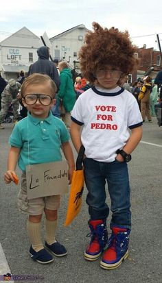 two young children standing next to each other