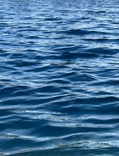 a boat floating on top of a large body of water