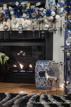 a fireplace decorated with blue and white ornaments