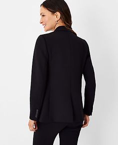 Elevate your professional wardrobe with the Ann Taylor Two Button Blazer in Double Knit. This blazer combines sophistication with comfort, featuring a stretchy, wrinkle-resistant fabric that ensures you stay sharp throughout the day. Perfect for mixing and matching, this piece is a versatile addition to any ensemble.

- Size: 00
- Color: Black
- Gender: Female
- Material: Shell - 78% Polyester, 15% Rayon, 7% Spandex; Lining - 100% Polyester
- Fit: Relaxed fit
- Length: Hits at hip, approximately Knitted Suit, Hip Style, Women's Blazers, Professional Wardrobe, Open Sleeve, Knit Blazer, Double Knit, Womens Blazers, Blazer Buttons