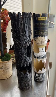 two vases that have been made to look like they are being used as halloween decorations