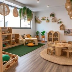 an indoor play room with wooden furniture and toys