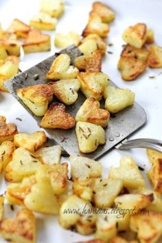 heart roasted potatoes on a baking sheet with text overlay that reads, heart roasted potatoes