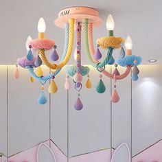 a chandelier hanging from the ceiling in a children's room