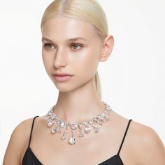 Ignite your style with the dramatic detailing of this Mesmera necklace. Made for extravagant luxury, the rhodium plated design has been crafted with an all-round array of facetted crystals. The mixed cuts and sizes are a tribute to Swarovski’s renowned savoir-faire, giving you a piece of jewelry that is wondrous and hypnotic. Gift this to a loved one as their ultimate statement choice. Stackable Ring Sets, Pink Watch, Holiday Earrings, Blue Watches, Swarovski Necklace, Cuff Rings, Holiday Earring, Tennis Necklace, Layered Jewelry