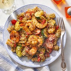 a plate with pasta and shrimp on it