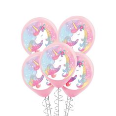 pink unicorn balloons with white stars and rainbows on them are arranged in a cluster