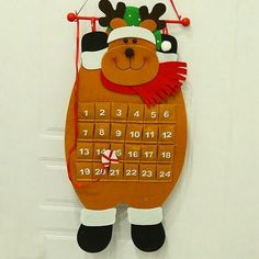 a wooden calendar with a reindeer on it