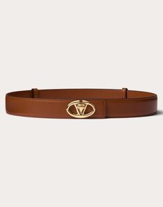 Valentino Garavani The Bold Edition VLogo calfskin belt. - VLogo Signature gold-finish buckle - Calfskin exterior - Calfskin interior - Valentino Garavani logo - Dimensions: H 30 mm / 1.2 in. - Made in Italy Brown Leather Belt With Logo Plaque, Classic Brown Belt With Logo Plaque, Brown Leather Belt With Gold-tone Logo Plaque, Luxury Brown Calf Leather Belt, Brown Leather Belt With Metal Logo, Luxury Brown Belt With Metal Logo, Designer Brown Belt With Metal Logo, Elegant Brown Calf Leather Belt, Hamptons Outfit