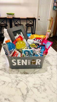 a basket filled with snacks sitting on top of a counter