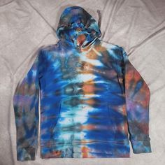 Abstract pattern with shades of grey, red, blue and orange throughout.  Made with 80/20% Next Level brand. Item has been washed multiple times at this point and will not risk bleeding. Dye Patterns, Ice Dye, Dye Hoodie, Ice Dyeing, Tie Dye Hoodie, Tie Dye Patterns, Blue And Orange, Shades Of Grey, Abstract Pattern