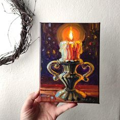 a painting of a lit candle in a vase