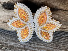 Hello Sunshine  Three iridescent fiery orange horse eye cabs are set to resemble a flower/butterfly accented with silver-lined gold seed beads to give it even more sparkle. They measure 1 1/2" inches wide & almost 3" inches long, on a post backing with a Italian leather backing finishes these earrings perfectly  These will sparkle and shine in natural or artificial light picking up many colour shades, pictures don't do these earrings justice. ALL ITEMS ARE MADE TO ORDER AND DONE IN ORDER OF PURC Adjustable Yellow Beaded Earrings For Festivals, Artisan Yellow Beaded Earrings Gift, Shades Pictures, Unique Yellow Beaded Earrings, Butterfly Wing Beaded Earrings, Yellow Beaded Earrings, Beaded Orange, Beaded Earrings Native White Red Yello Orange, Horse Eye