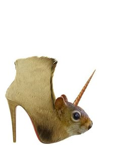 an animal's shoe is shaped like a squirrel