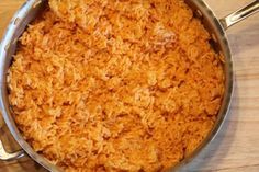 a pan filled with rice sitting on top of a counter