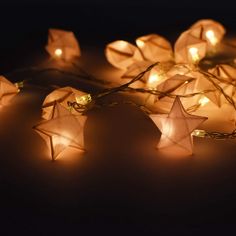 star shaped string lights on a black background