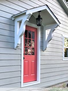 a red door with the words how to build a small house over a door