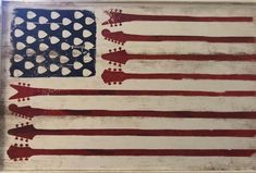 an american flag painted on wood with white dots and red, white, and blue stripes