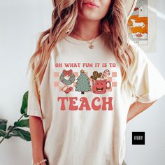 "🎄 Get ready to spread some holiday cheer with our Retro Matching Christmas Teacher Comfort Colors T-Shirt! This festive tee is not only vintage inspired but also the perfect gift for your favorite educator. Whether you're decking the halls or rocking matching shirts with your fellow teachers, this design will have you feeling jolly all season long. Get yours today and make this Christmas season extra special! 🎄 HOW TO ORDER * Review all photos & check all size chart measurements before deciding on size. * Select the correct shirt size and shirt color from drop-down menus. * To order more products, click the back button & repeat. * Once items are in your cart, enter correct address, then hit submit. :) 🎄 QUALITY * Comfort Colors Brand Shirts * Garment-dyed t-shirt * Cozy 100% ring-spun Casual Pre-shrunk Christmas Shirt, Festive Cotton T-shirt With Graphic Print, Festive Cotton Graphic Print T-shirt, Festive Cotton Tops With Graphic Print, Holiday Cotton Graphic Tee Shirt, Cotton Graphic Tee Shirt For Holidays, Christmas Graphic Tee Shirt In Cotton, Christmas Cotton Graphic Tee Shirt, Festive Casual Cotton T-shirt