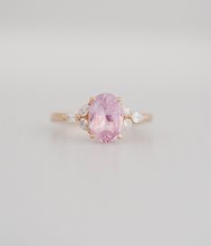 "Blush sapphire engagement ring. Engagement ring by Eidelprecious. This is our new Trillium design! The ring features a 4.5ct oval sapphire. The color is gorgeous light blush pink. The sapphire is very beautiful and clean. This beauty is set in my Trillium setting, featuring 3 pear diamond on each side of the center stone. 14k rose gold diamond setting, SI/H. Available in 14k white gold. SZ 6, can be resized. Matching diamond is available and can be ordered separately https://www.etsy.com/listin Oval Pink Morganite Diamond Ring, Oval Brilliant Cut Pink Sapphire Ring, Oval Pink Sapphire Ring In Pink Gold, Rose Gold Oval Pink Sapphire Ring, Oval Rose Gold Pink Sapphire Ring, Oval Pink Sapphire Ring In Rose Gold, Pink Gold Oval Sapphire Ring Fine Jewelry, Oval Pink Gold Sapphire Ring, Pink Gold Oval Sapphire Ring