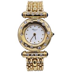 This beautiful, hard-to-find late 20th century timepiece features a round white face with gold dot hours within a wide, rounded bezel punctuated with clean white diamonds. The Imperiale-style lug bars are also set with diamonds. The crown and the ends of the lug bars are tipped with sapphire cabochons. The heavy link band is solid 18 karat yellow gold. The original box is included. A distinctive and elegant piece of jewelry, as well as a superbly crafted timepiece. Case size: 23.3mm Case thickne Luxury Vintage Yellow Gold Jewelry, Luxury Vintage Round Watches, Luxury Vintage Gold Chronograph Watch, Stone Case, Chopard Jewelry, Chopard Watch, Gold Diamond Watches, Jewelry Promotion, Gold Dot