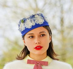 "DESCRIPTION * vintage hat from 1950s-1960s * pillbox design: brimless, round flat crown, fitted to the head * made of blue fabric * decorated with ombre blue flowers and embellished with faux pearl stamens * hat is lined with stiff chicken wire blocking net without metal rim, breathable and lightweight * no tag CONDITION * Hat is in good vintage condition and shows signs of normal use, the lining fabric has some holes and fabric thinning but it does not affect the exterior of the hat. Please se Vintage Spring Cloche Hat For Party, Vintage Headpieces For Spring Events, Vintage Adjustable Fascinator For Spring, Spring Vintage Cloche Fascinator, Spring Vintage Fascinator For Vintage Events, Vintage Spring Headpieces For Church, Retro Mini Hats With Short Brim For Spring, Vintage Spring Fascinator For Garden Party, Retro Mini Hat With Short Brim For Spring