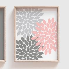 two framed pictures with pink and gray flowers on them