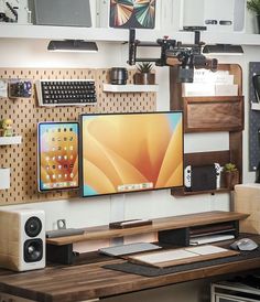 a computer monitor sitting on top of a wooden desk