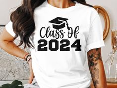 Commemorate the special moment of graduation with our Class of 2024 T-Shirt. This comfortable, unisex tee is the perfect way to celebrate a significant milestone for high school or college seniors. Crafted from soft materials, it's designed to provide a relaxed fit for all-day wear during graduation festivities or as a memorable keepsake. Honor your graduate's achievement with this stylish and timeless graduation apparel. Ideal for grad parties, senior events, or as a gift for a proud 2024 graduate! Primary School Graduation, Senior Events, 2024 Graduate, Custom Top, College Senior, 2024 Graduation, Class Of 2024, Grad Parties, School Graduation