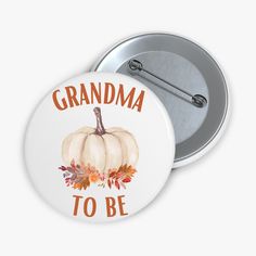 a button with the words cousin to be written on it and a pumpkin