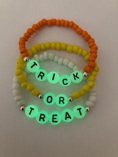 *This adorable glow in the dark candy corn theme bracelet set will make a great set for the holidays!* *Please measure wrist before ordering.* **Please roll on bracelet rather than stretch on to prevent breaking.** If you would like to customize your bracelets,please feel free to message me Holiday Beaded Bracelet, Candy Corn Beaded Bracelet, Bracelet Flat Beads, Stretch Bracelet Ideas, Clay Bead Fall Bracelets, Candy Corn Bracelets, Fall Clay Bracelets, Halloween Kandi Bracelets