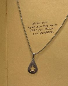 a necklace with a message written on it that says guess you have all the pain that you think you deserves