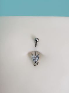 In addition to the standard 11mm steel or PTFE plastic for pregnancy belly button rings, this jewelry has the option to be made from longer-than-standard stainless steel bent shaft - hypoallergenic, anti-rust, and will not discolor over time.  You'll be receiving the same 14g 316L stainless steel as with normal belly ring jewelry, only longer. Stainless steel options:    11mm    13mm    14mm    16mm 38mm (2") PTFE    5mm steel top ball  Acrylic heart - 8mm x 7.6mm Total charm length - 15.5mm x 9.7mm x 4.4mm More designs available at my website. Silver Surgical Steel Belly Rings As Gift, White Internally Threaded Belly Ring As Gift, Adjustable Metal Belly Rings Internally Threaded, Adjustable Internally Threaded Metal Belly Rings, Internally Threaded Surgical Steel Belly Rings As Gift, Nickel-free Stainless Steel Belly Rings As Gift, Nickel-free Stainless Steel Belly Rings For Gift, Adjustable Silver Heart Piercings, Hypoallergenic Stainless Steel Belly Rings As Gifts