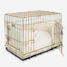 a dog cage with a pillow in it