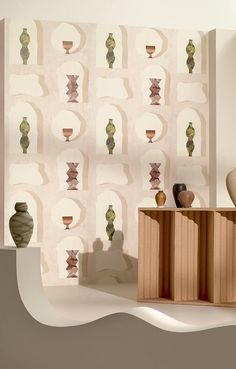 an abstract wallpaper with vases and other items on the shelf next to it