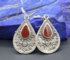 I am offering You! Vintage Turkmen Afghan alpaka tear drop earrings. Its %100 hand crafted workmanship with beautiful compressed carnelian stones and unique carved shape. Please do not hesitate to contact if you have any questions about items or further informations, Measures : 5cm ( 2" ) x 2cm ( 0.8" ) Weight : 8.4 Grams, Shipping & Estimated Delivery Time With Turkish Registered Post, Destination CountryStandard Shipping (business days) United States 15-20  Europe7-15 Asia15-25  Australia15-20 Traditional Teardrop Earrings As A Gift, Traditional Teardrop Earrings For Gift, Belly Dance Jewelry, Dance Jewelry, Traditional Earrings, Carnelian Stone, Belly Dance, Teardrop Earrings, Jewelry Earrings Dangle