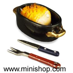 three different types of utensils in a black bowl